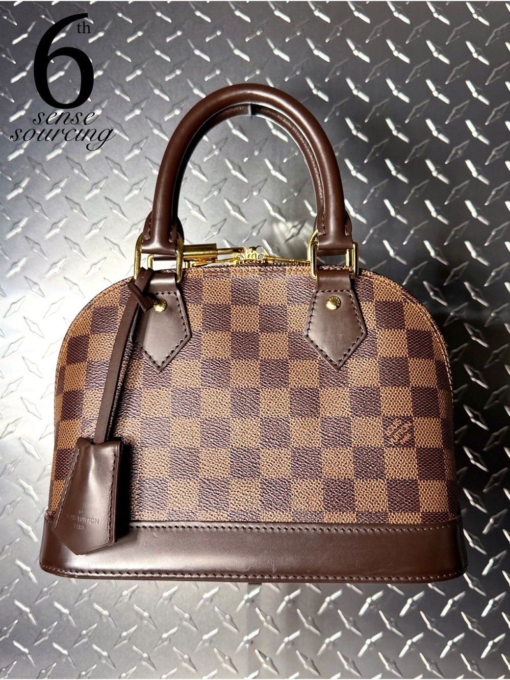 Louis Vuitton Damier Ebene Alma BB in Brown